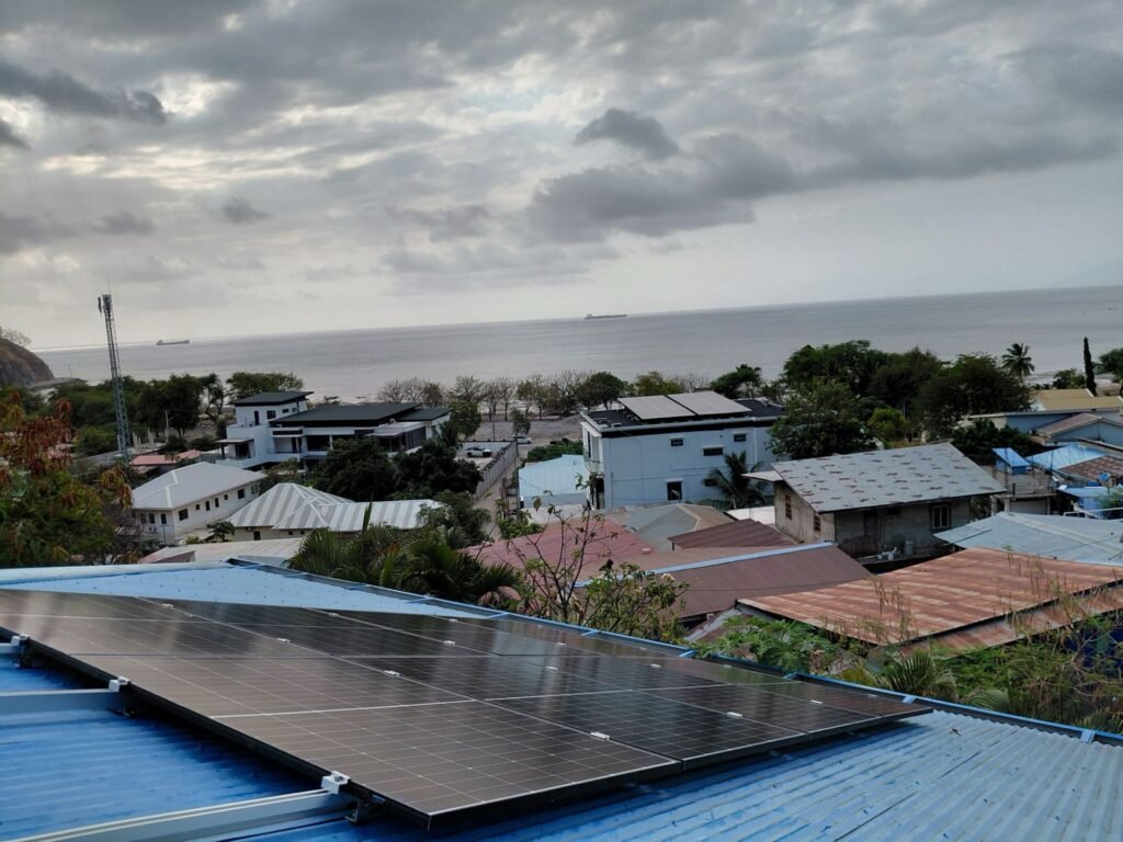 Completed residential solar array in Dili with a view of the sea