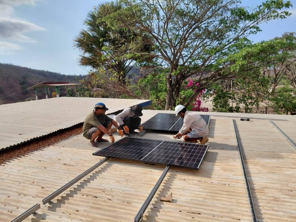 GoKoval technicians installing a rooftop solar array