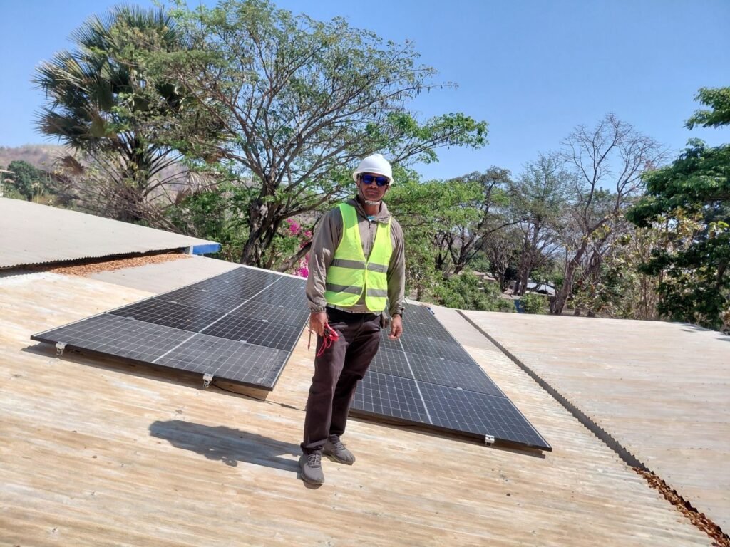 GoKoval technician on a completed rooftop solar array
