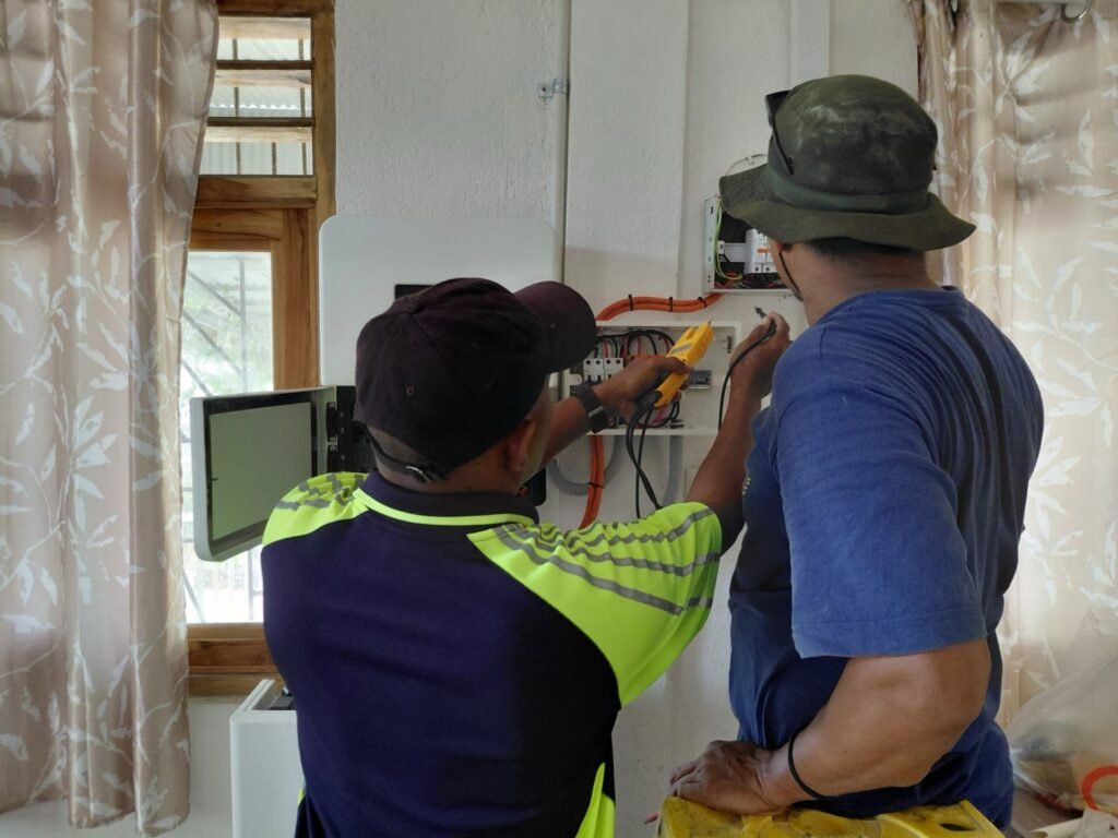 GoKoval technicians testing the installation with a clamp meter