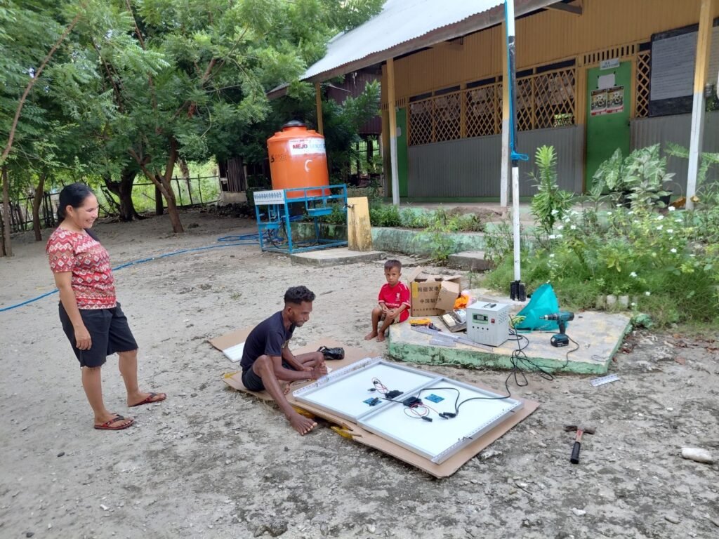 Assembling the solar panels at the school